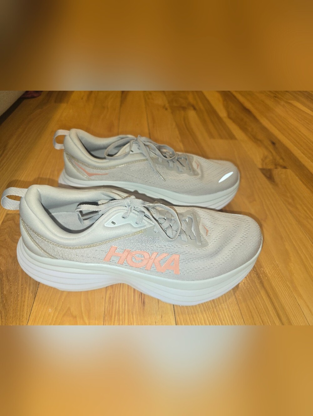 Hoka Bondi 8 Lightweight Running Shoes in Light Gray with Pink Logo